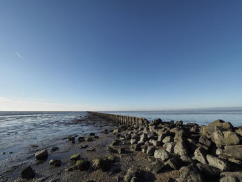 Scenic view of sea against clear blue sky