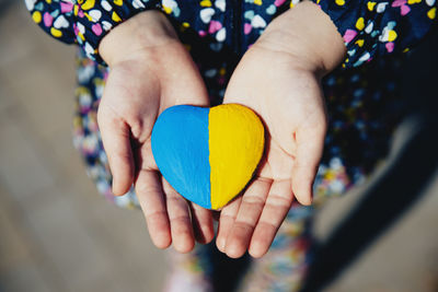 Cropped hand holding heart shape