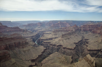 Aerial view of landscape against cloudy sky