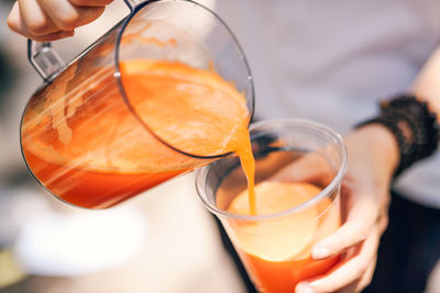 Close-up of hand holding drink
