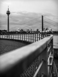 View of suspension bridge against cloudy sky