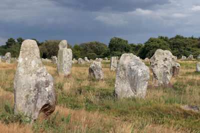 Panoramic view of cemetery on field against sky