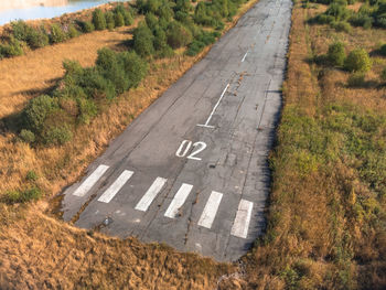 Runway of a small abandoned airfield. take-off road