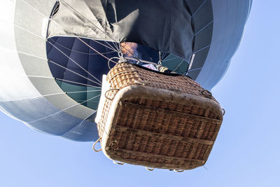 Low section of man against blue sky