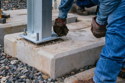 Low section of man working at construction site