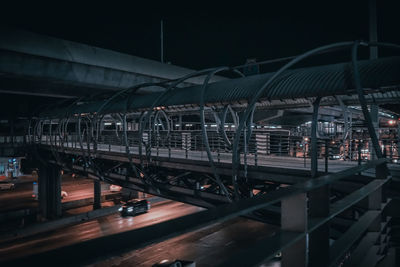 Bridge over illuminated city at night