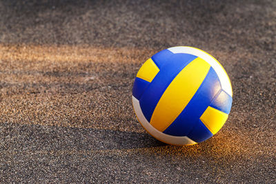 High angle view of soccer ball on road