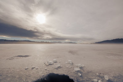 Scenic view of sea against sky during winter