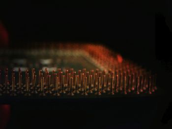 Close-up of lighting equipment against black background