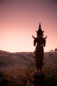 Statue of buddha against clear sky