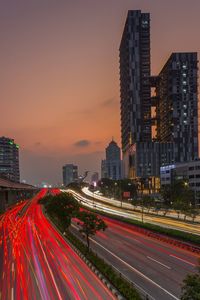 High angle view of light trails on road at sunset