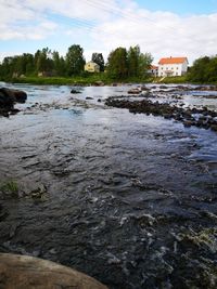 Scenic view of river against sky