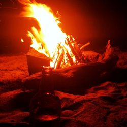 Close-up of fire burning at night