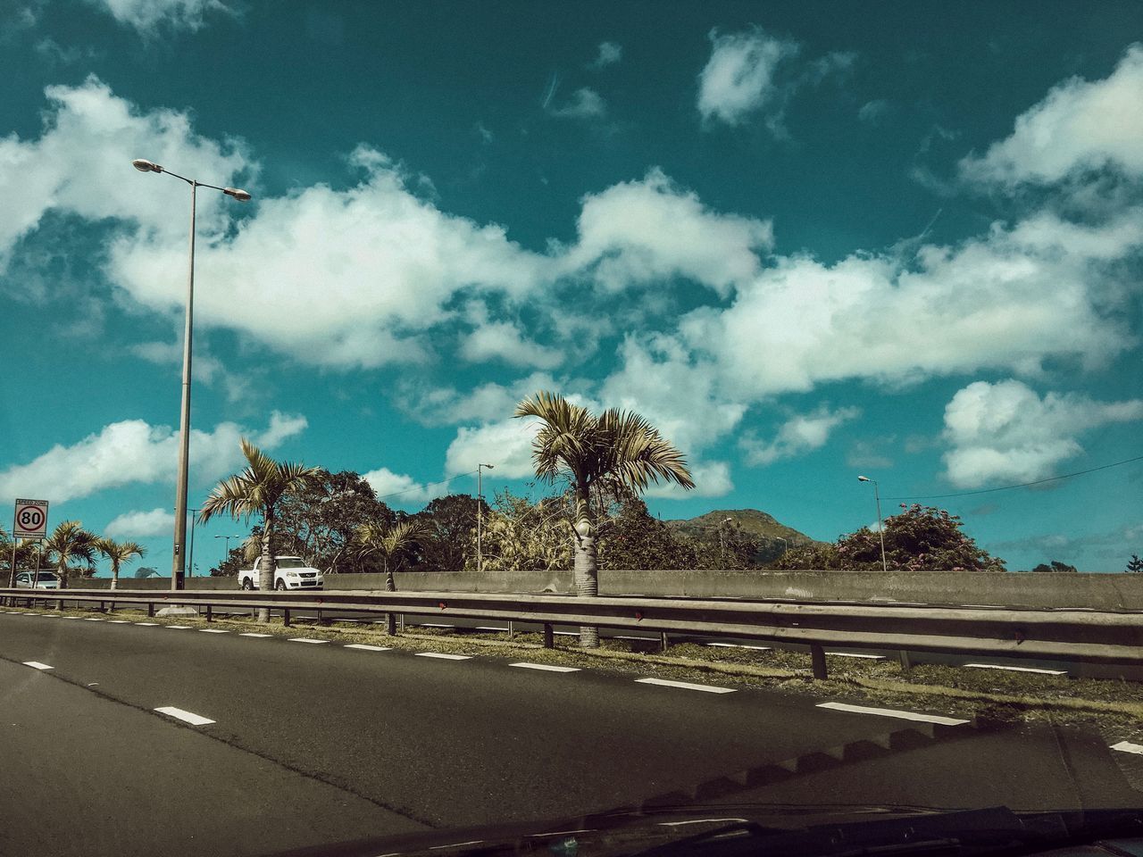 EMPTY ROAD AGAINST SKY