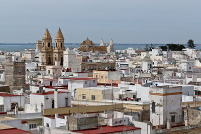 Buildings in city against sky