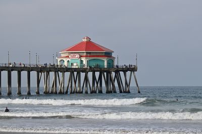 Lifeguard hut on beach against clear sky