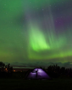 Illuminated tent on land at night