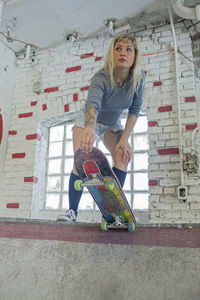 Young woman skateboarding.