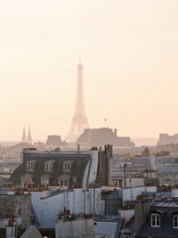 Tower in city against sky