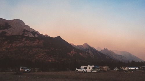 Scenic view of mountains against clear sky during sunset