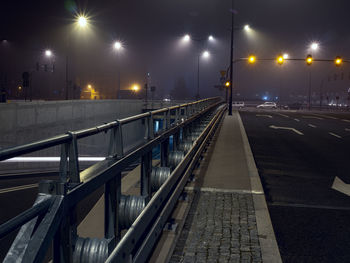 Foggy night city lights and road scene
