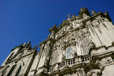 Low angle view of traditional building against blue sky