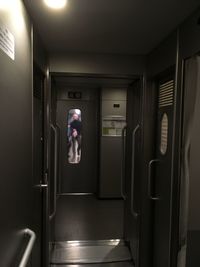 Reflection of man in train