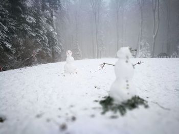 Rear view of child playing in snow