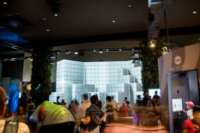 Group of people in illuminated room