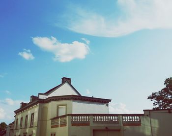 Low angle view of building against blue sky