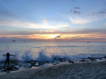 Scenic view of sea at sunset