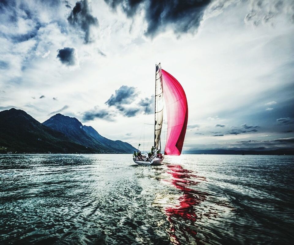 sky, water, transportation, sea, nautical vessel, cloud - sky, waterfront, boat, mode of transport, cloud, mountain, rippled, beauty in nature, tranquil scene, scenics, tranquility, cloudy, nature, red, outdoors