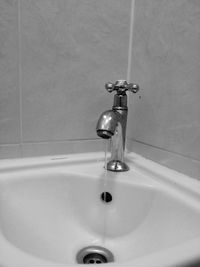 Close-up of faucet in bathroom