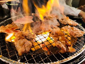 Close-up of meat on barbecue grill