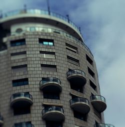 Low angle view of office building against sky