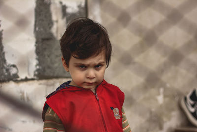 Portrait of cute boy standing outdoors