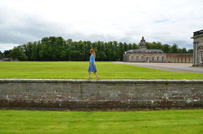 Full length of woman standing on field