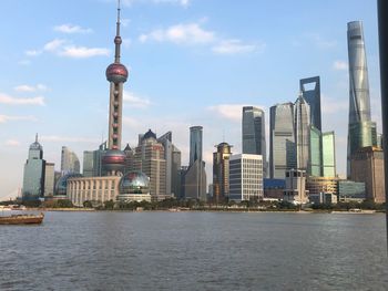 Modern buildings in city against sky