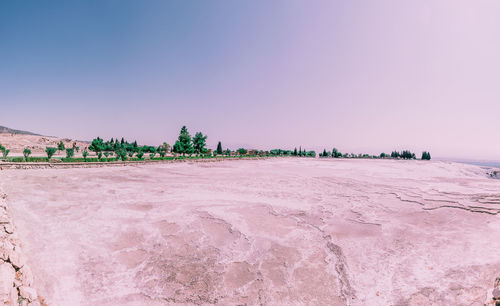 Scenic view of beach against clear sky