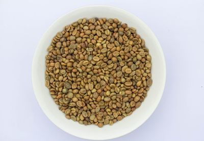 High angle view of bread in bowl against white background