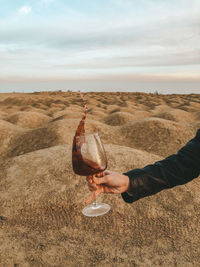 Midsection of man having food against sky