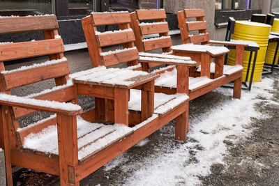 Empty chairs and tables in winter