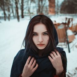 Portrait of beautiful woman with snow