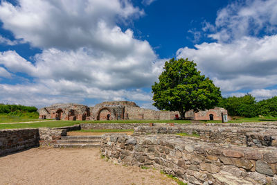 View of old ruins against cloudy sky