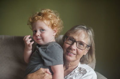 Portrait of grandmother and grandson at home