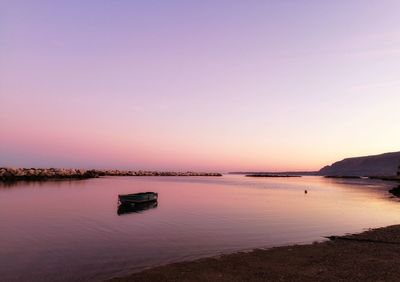 Scenic view of sea against clear sky during sunset