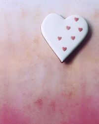 High angle view of heart shape on white table