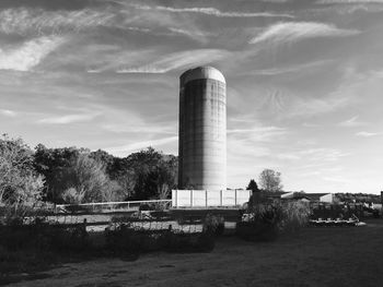 Built structure on landscape against the sky