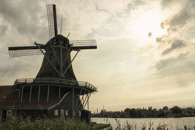 Traditional windmill against sky