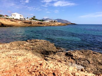 Scenic view of sea against cloudy sky